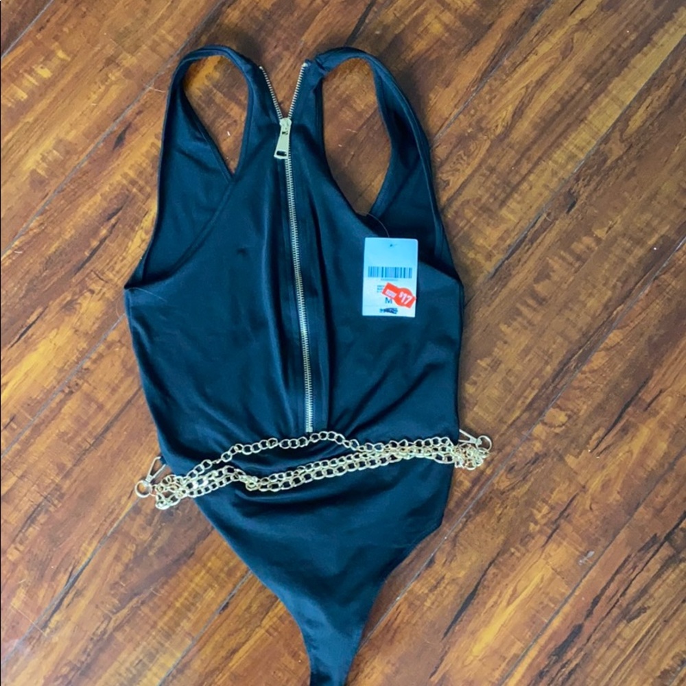 Black body suit with gold chains